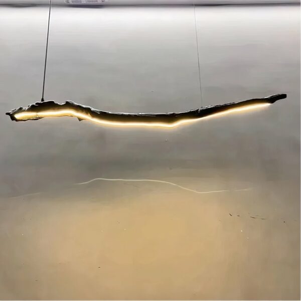 Suspended driftwood chandelier with a full-length LED strip. Grey wall in background.