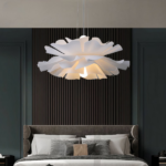 Flower-shaped petal chandelier in acrylic on a grey background in a bedroom