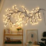 Garland-type headboard wall light, positioned on a wall in a bedroom