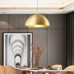 Vintage-style gold-plated brass LED hanging lamp on grey background with picture and table with chairs