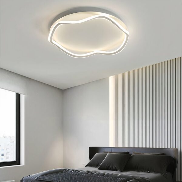 Modern white aluminium chandelier on grey background in a bedroom