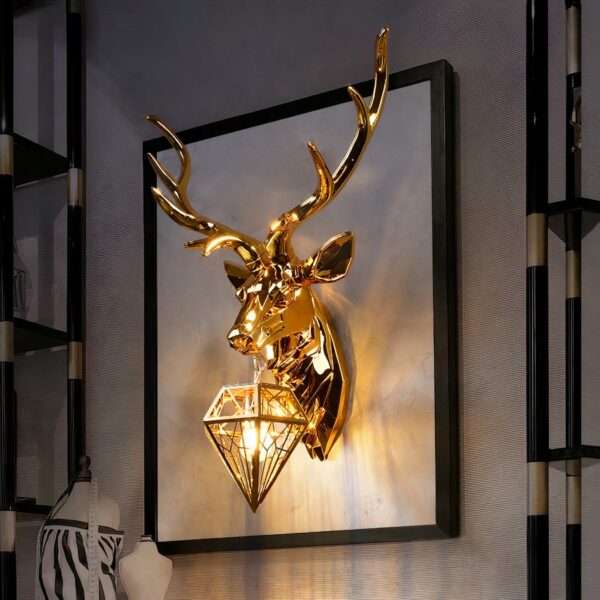 Headboard wall lamp in the shape of a deer in gold, with a lantern around its neck, positioned on a large whiteboard