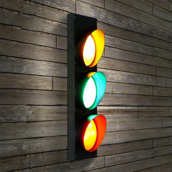 Vintage LED traffic light wall lamp on brown wood background