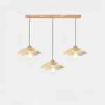 Chandelier with three pendants, a rectangular wooden base and glass pendants in the shape of a flower. On a white background.