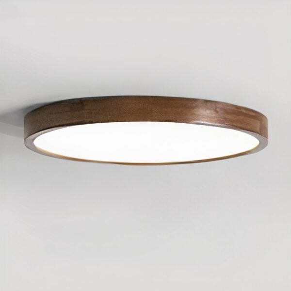 Round LED chandelier in wood and acrylic, glued to the ceiling. Grey background.
