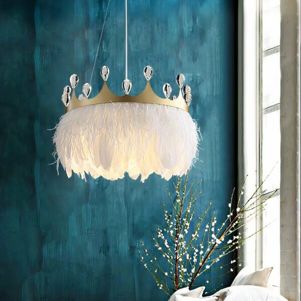 White feather pendant and crown adorned with faux diamonds. Behind a duck-blue wall, on the right, a white-paned window. And below, branches with flowers in a vase.