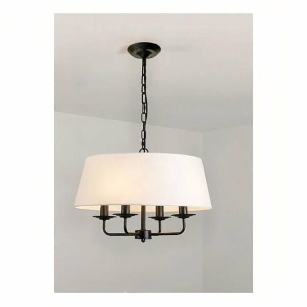 we see a suspended chandelier in black and white wrought iron on a light grey background