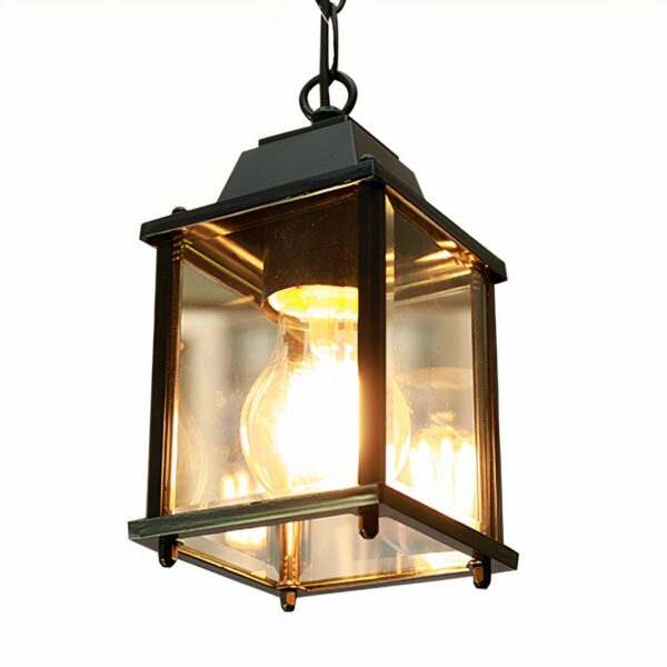 A black vintage lantern-shaped chandelier is lit against a white background.