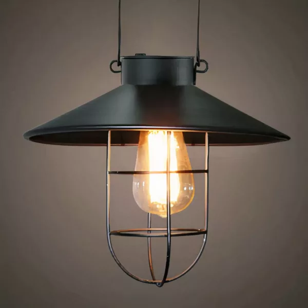 Vintage Style Black Solar Lantern Pendant Light Black solar-powered hanging lamp in vintage lantern style, presented lit