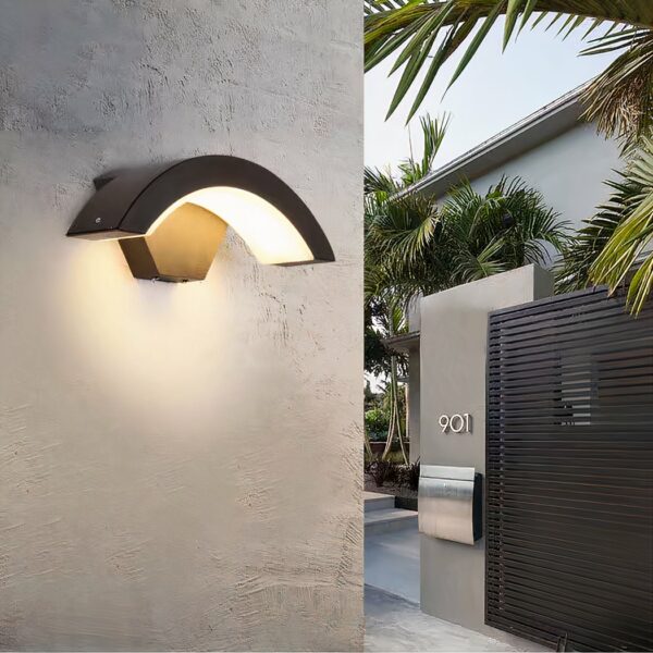 Waterproof, arcuate gray wall-mounted luminaire for outdoor applications