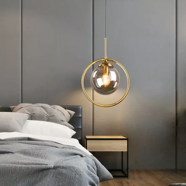Glass ball-shaped led lampshade hanging over a bed