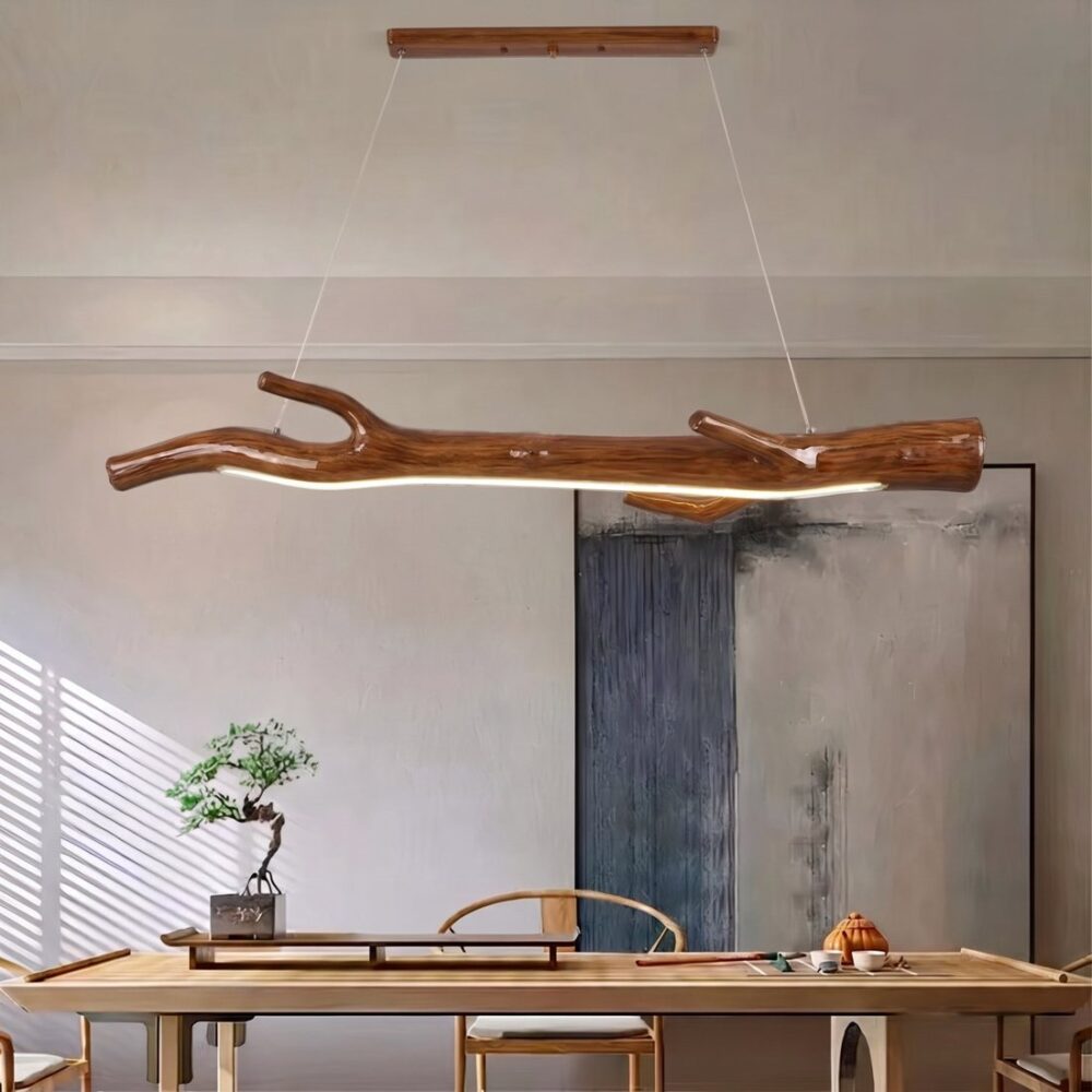 Resin branch chandelier with a wood look, satin chestnut brown, LED strip lit above a table
