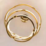 Underside view of the layered gold ring chandelier glowing in spirals