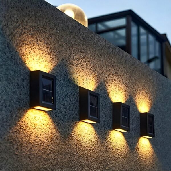 Solar-powered rectangular outdoor waterproof LED wall light on a garden wall