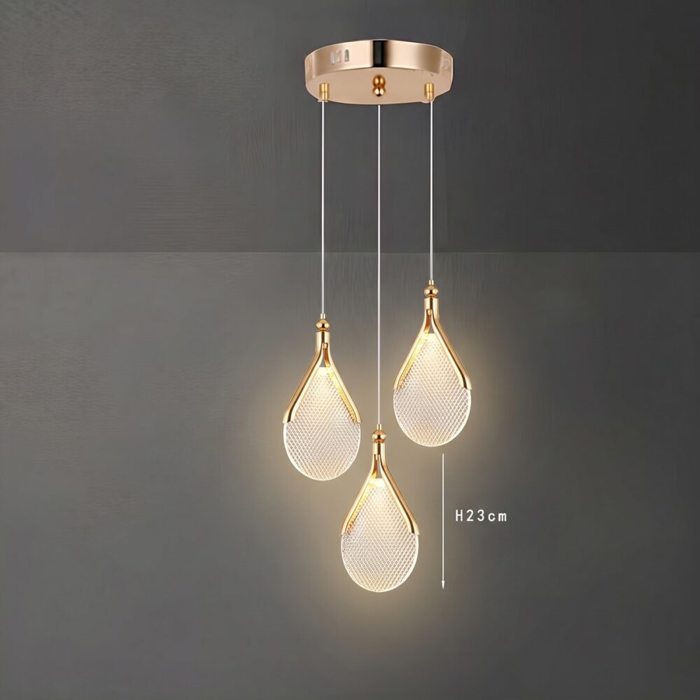 Chandelier with flat diamond-cut acrylic drops and gold frames in a bedroom