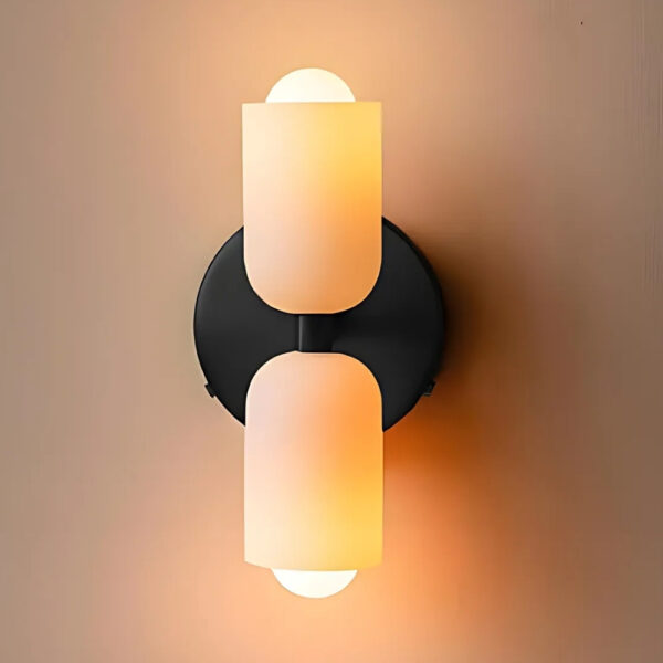 Black wall light with two vertical opal glass cylinder shades