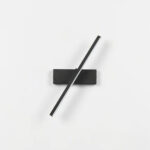 Slim bar wall light shown pivoted diagonally on a plain background, unlit