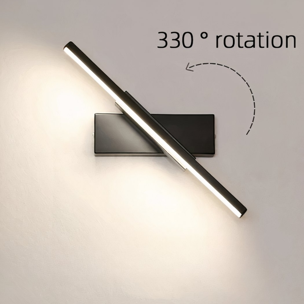 Slim adjustable bar wall light shown pivoted diagonally, glowing white