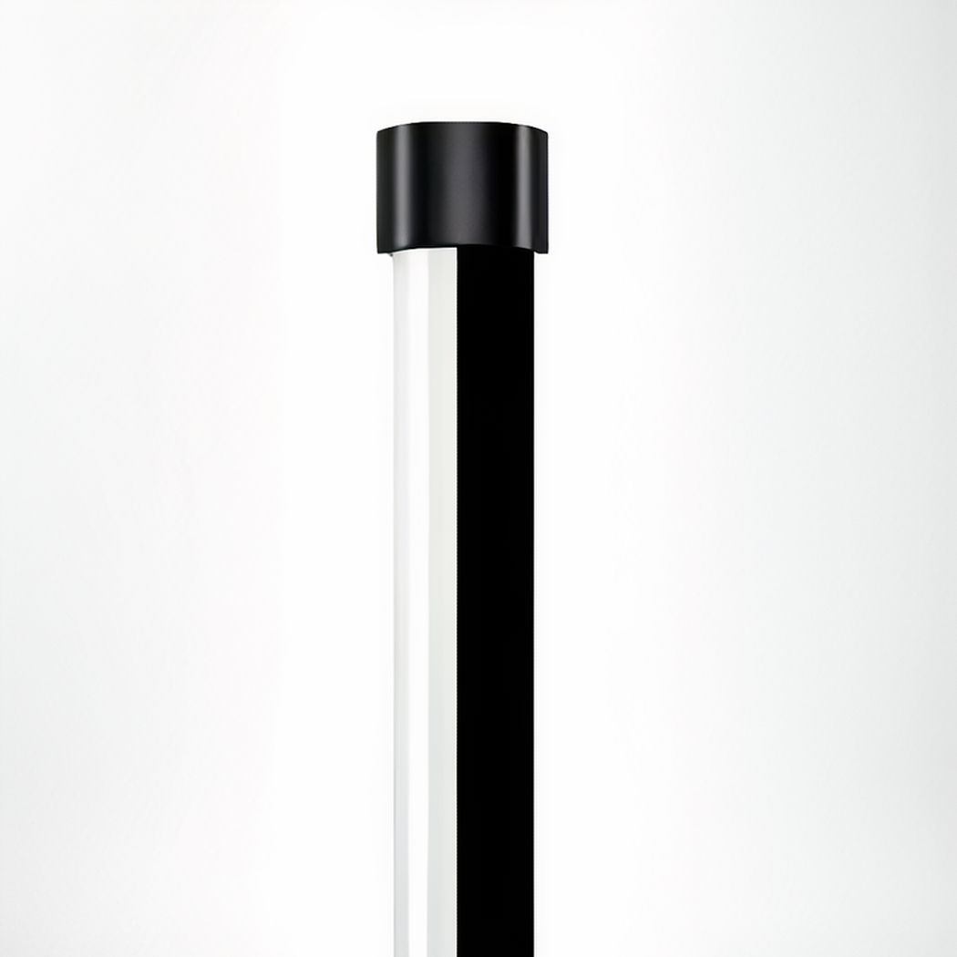 Close-up of a floor lamp tube joint between black cap and diffuser section
