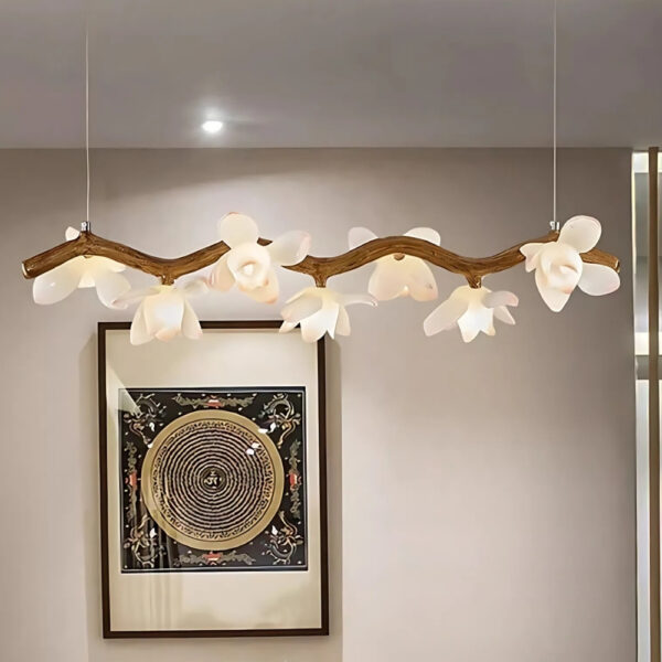 Branch shaped chandelier with white flower blossoms in a driftwood finish