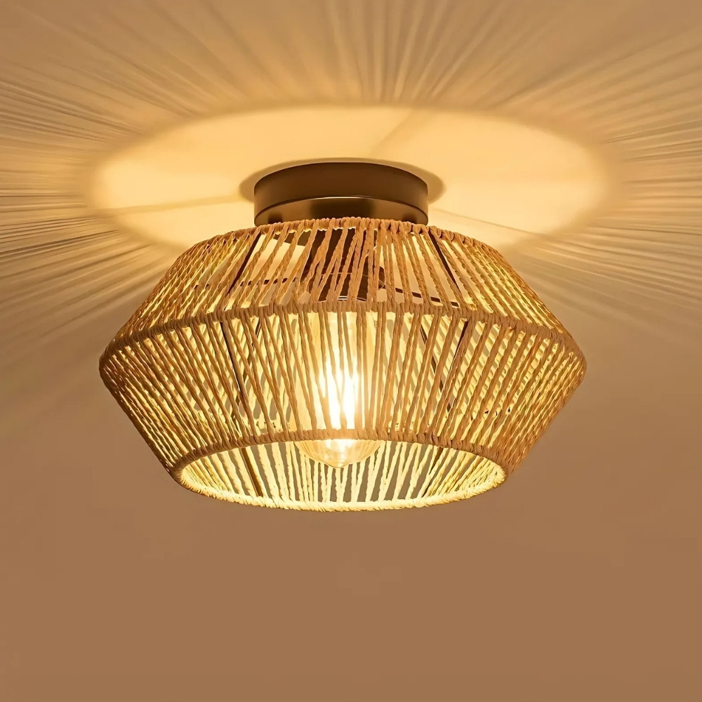 Woven rattan drum ceiling light glowing warmly from within