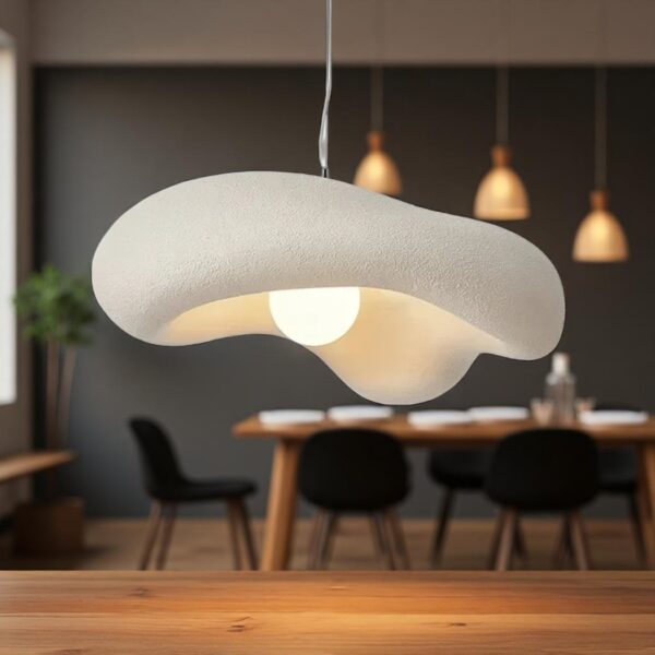 Japandi resin pendant lamp with organic minimalist shape Organic curved white resin pendant light with a round glass globe