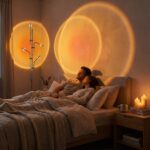 Halo sunset floor lamp casting a large orange light circle above a bed