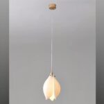 White magnolia-shaped ceramic pendant light on a long hanging cord