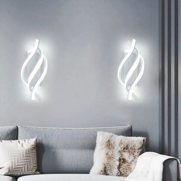 Pair of white spiral shaped LED wall lights above a sofa