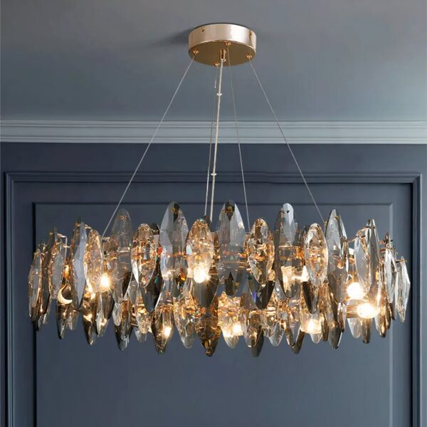 Round crystal chandelier with faceted glass drops on a gold frame
