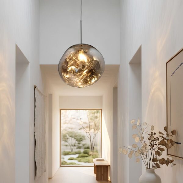 Designer modern hallway pendant light in silver, ball shape hanging in a Japandi-style entrance hall