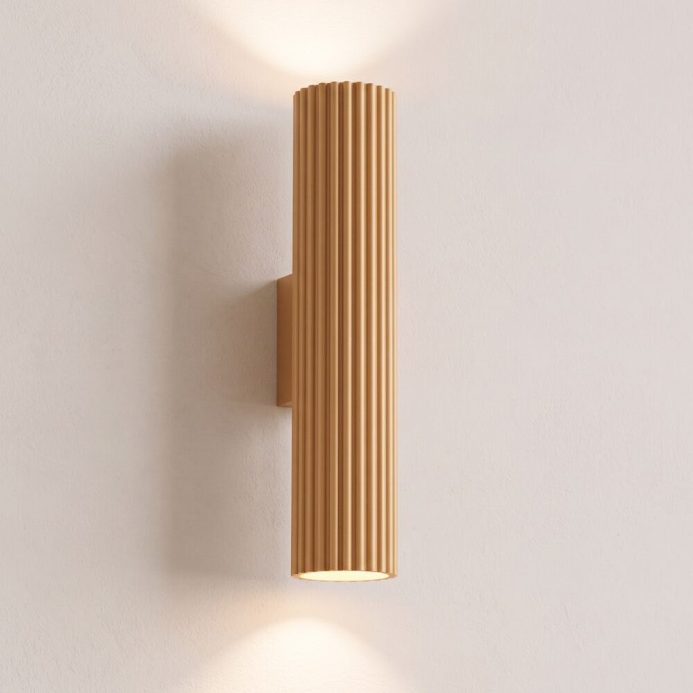 Design ribbed wall light in matt gold aluminium