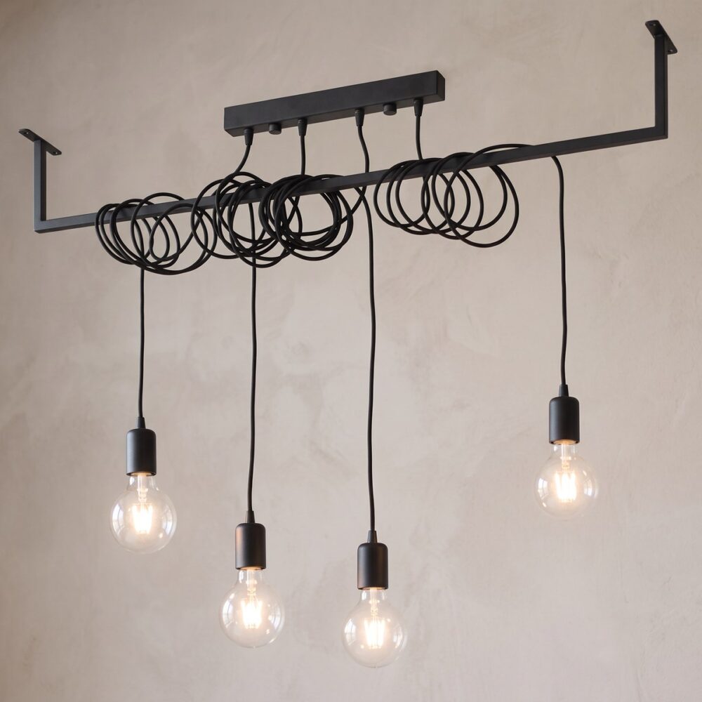 4-bulb industrial chandelier on a coiled-cable rail
